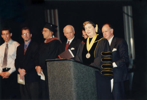 UNC System President Molly Broad makes a speech. Seated behind are (left to right): Eric Trader, William Huesman, Henry Grillo, John W. Davis III, Robert Flynn Orr, Jack Cavanaugh.