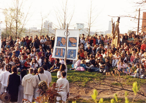 Unidentified members perform their show for audience on the hill near Performance Place.