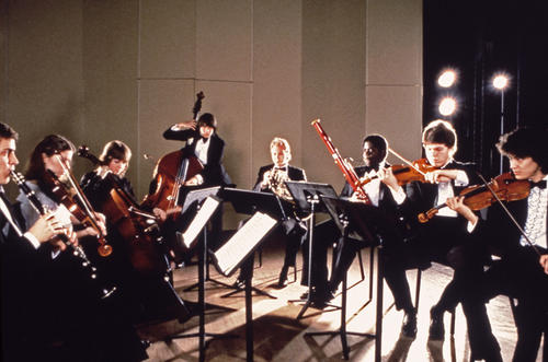 Students with their instruments performing on stage., Slides used for 1993 Public Relations presentation